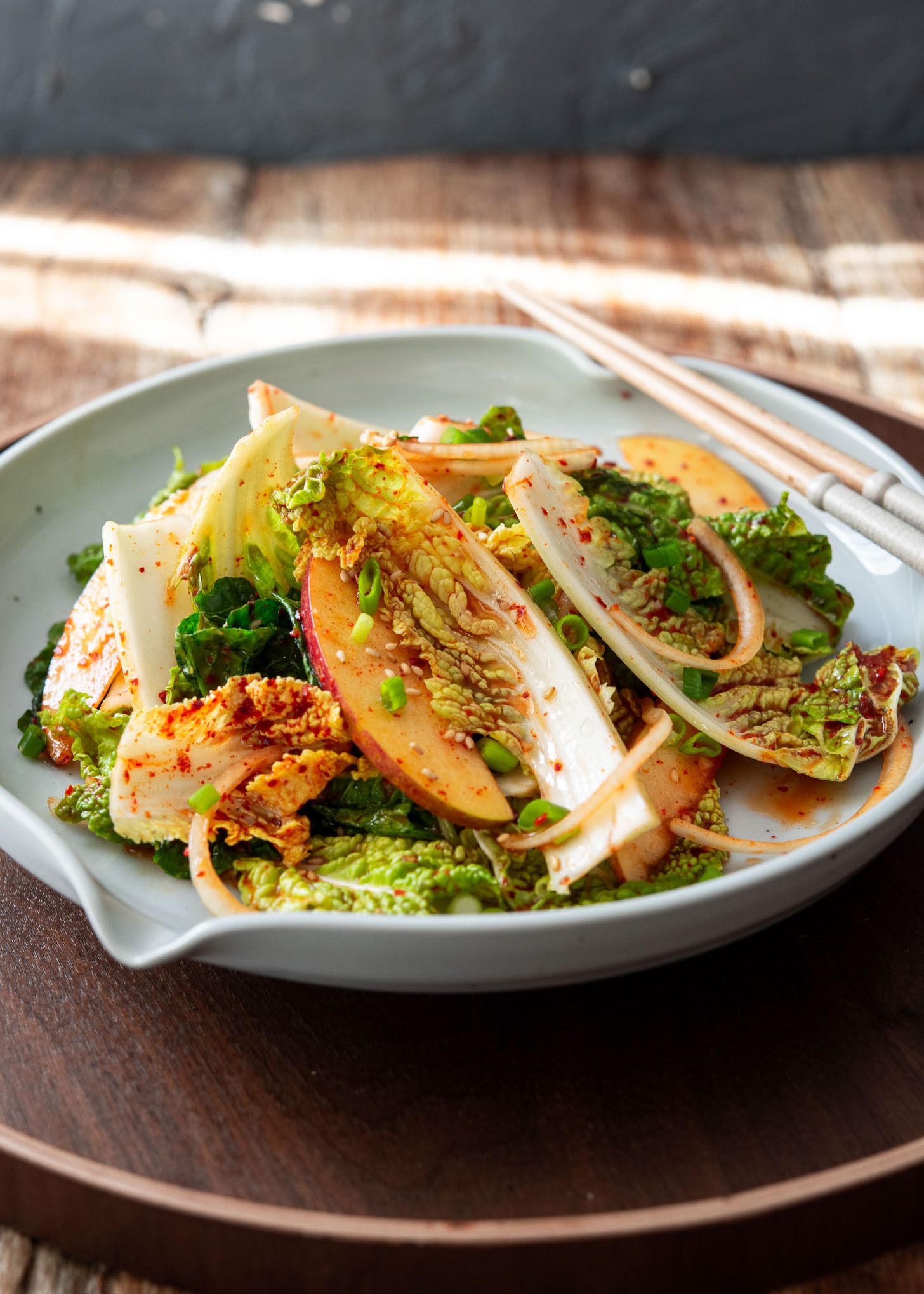 Fresh Bomdong Salad (Korean spring cabbage geotjeori) with apple slices and spicy dressing