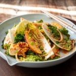 Fresh Bomdong Salad (Korean spring cabbage geotjeori) with apple slices and spicy dressing