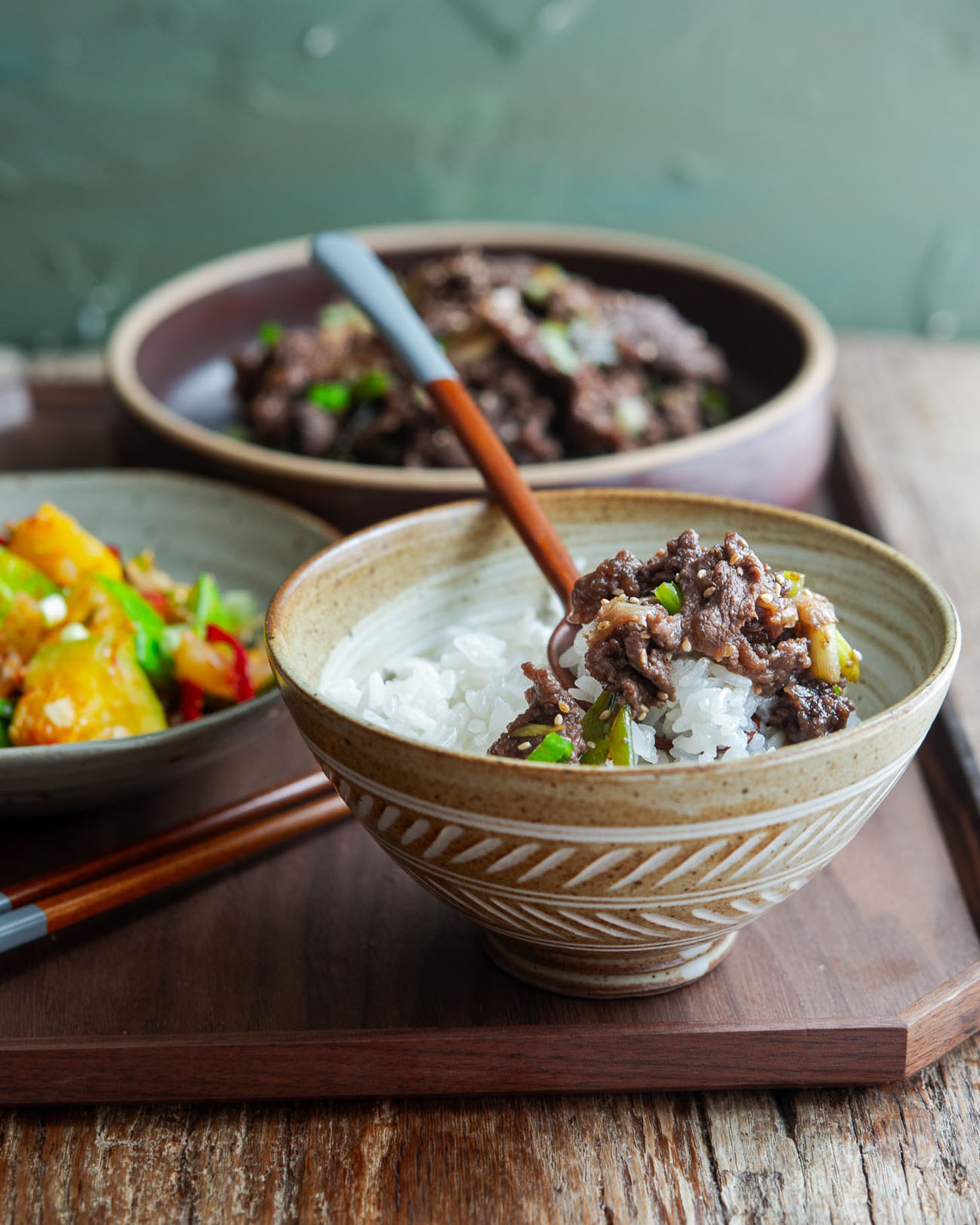 Close-up of Korean beef bulgogi over rice with glossy caramelized slices