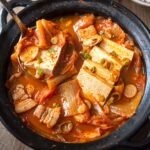 Kimchi jjigae with pork tofu and kimchi in Korean stew pot