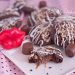 chocolate caramel cookies with red lip novelty on a plate.