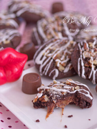 chocolate caramel cookies with red lip novelty on a plate.