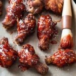 Crispy Korean fried chicken (yangnyeom) glazed with spicy sauce and sesame seeds