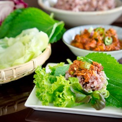 Korean lettuce wrap (Ssambap) with multigrain rice and fish topping.