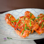 Korean chili crab on a serving platter.