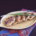 Kimchi shrimp patties are on a leaf patterned plate