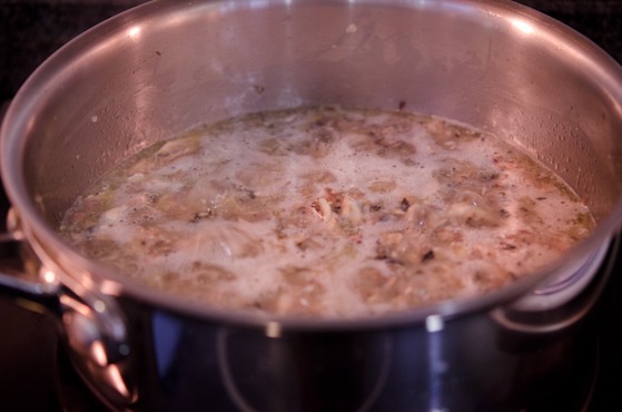 Topping sauce ingredients are simmering in a pot.