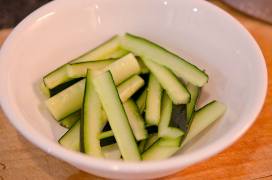 Cucumber sticks are coated with salt to extract the moisture.
