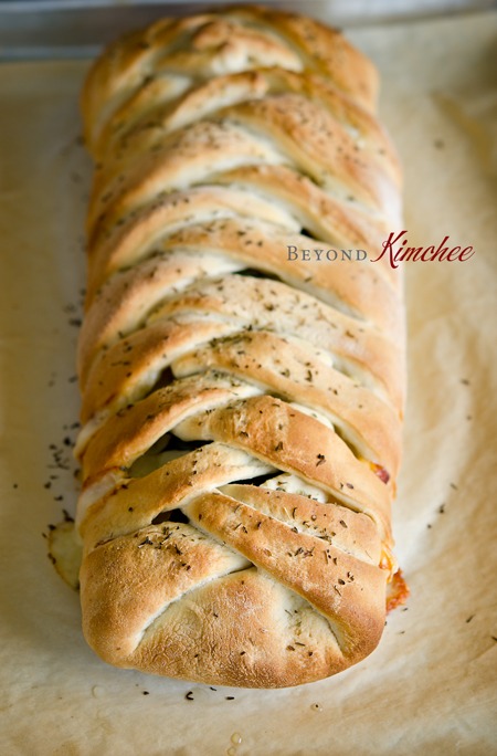 Stromboli with a braided look is baked in oven