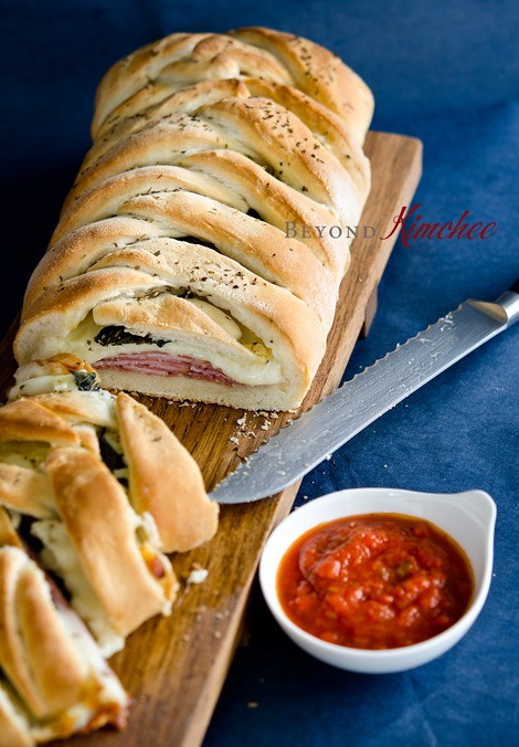 Homemade Stromboli is made with a refrigerated pizza dough and served with marinara sauce.