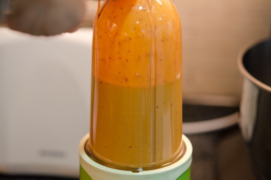 peri-peri sauce is pureed in a small blender.