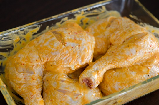 Chicken legs are coated with peri peri sauce marinade,