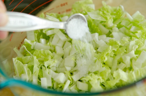 Salt is added to the cabbage