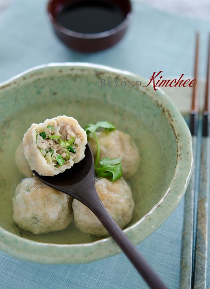 Dumpling balls made with pork and cabbage and simmered in water.