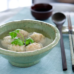 Gluten free dumplings in a bowl of broth.