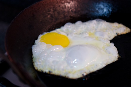 An egg is cooked to a sunny side up.