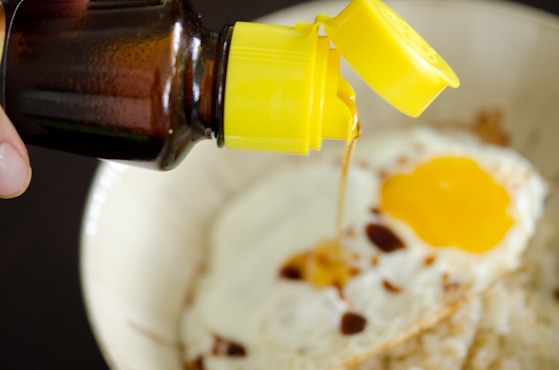 Sesame oil is drizzled over Korean egg rice