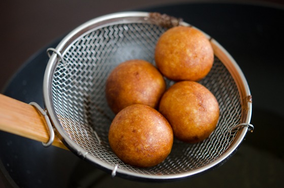 Sweet potato rice donut is deep-fried to golden brown and strained from the oil.