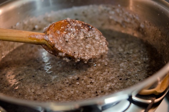 Black sesame porridge is simmered in a pot.