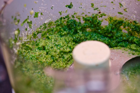 Pesto sauce is made in a food processor.