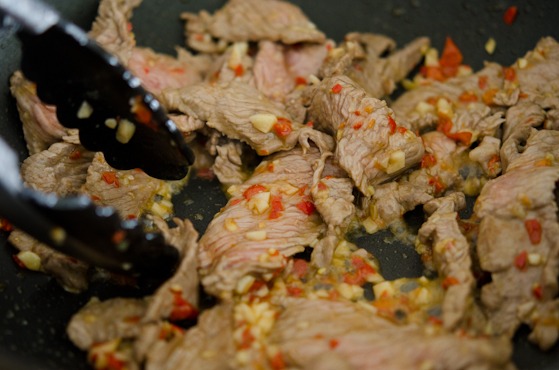 Beef slices are added to the chili garlic mixture to make Thai beef basil stir-fry