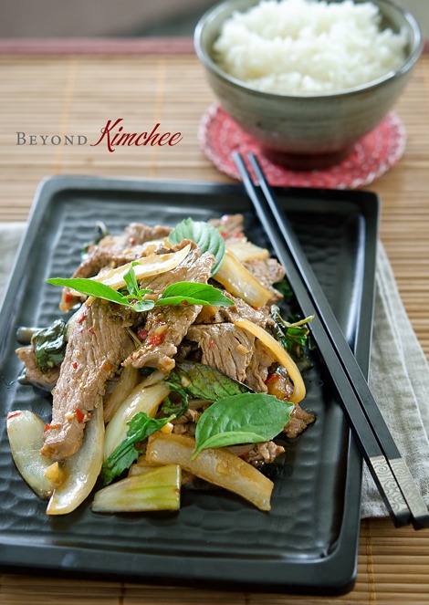 Beef, onion, fresh chili, and Thai basil is stir-fried in savory sauce and served with rice.