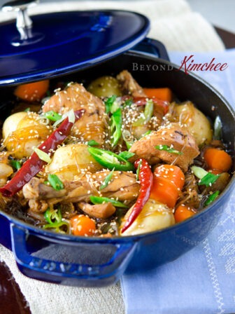 Korean chicken is braised in cola drink with potato, carrot, and korean noodles.