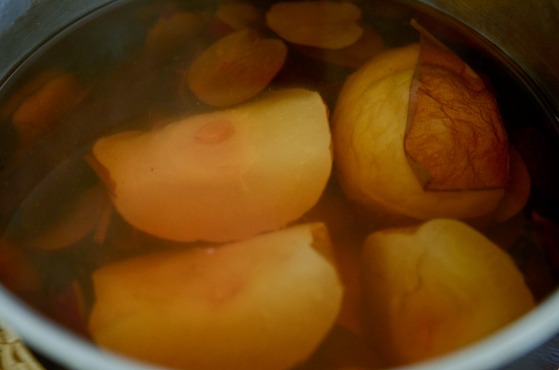 Simmer Korean pear, jujube, ginger, and cinnamon stick with water in a large pot.
