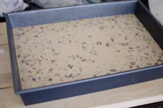 LA rice cake batters are added to a greased baking pan.
