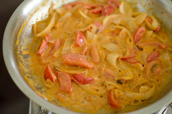 Simmer kimchi tomato pasta sauce until thickened.