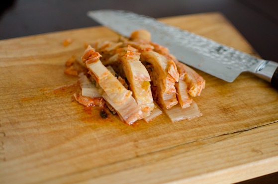 Slice kimchi into strips.