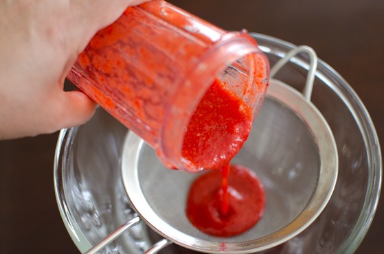 Pour the strawberry puree in a fine mesh to collect the seeds.