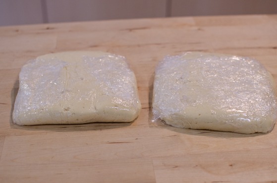 Divide the dough in half and wrap with plastic wrap and chill in the refrigerator.