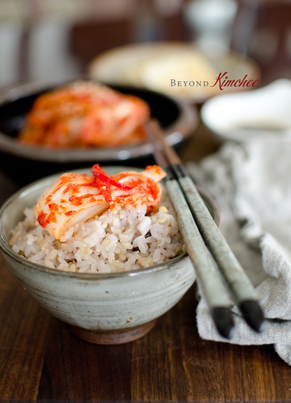 A piece of quickly made kimchi is served with rice.