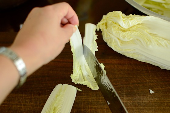 Slice the cabbage leaf  in half lengthwise.