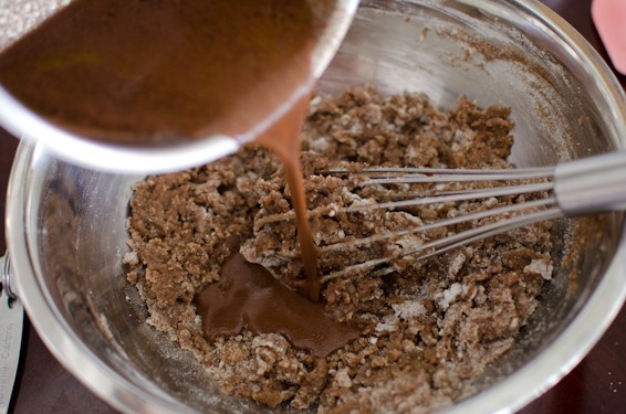 Whisk the cake batter as you pour cocoa butter mixture.