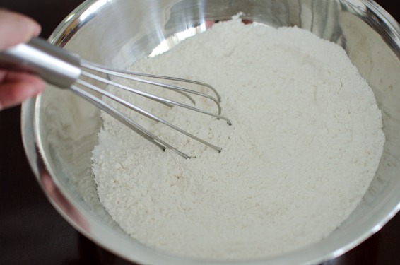 Dry ingredients for chocolate sour cream bundt cake is whisked together.