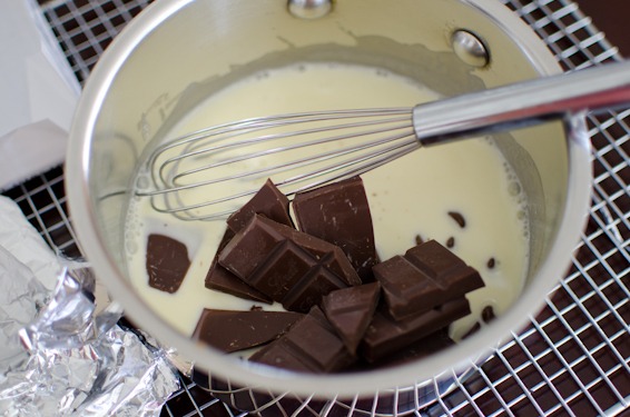 Add the chocolate pieces to a hot cream mixture.