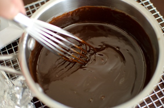 Stir the chocolate ganache until smooth and shiny.