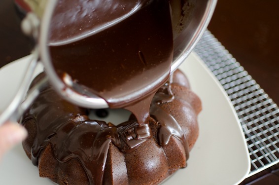 Pour chocolate ganache glaze over a cooled chocolate sour cream bundt cake.