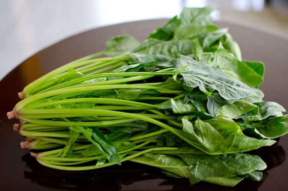 A bunch of whole spinach is used to make Korean spinach pancakes.