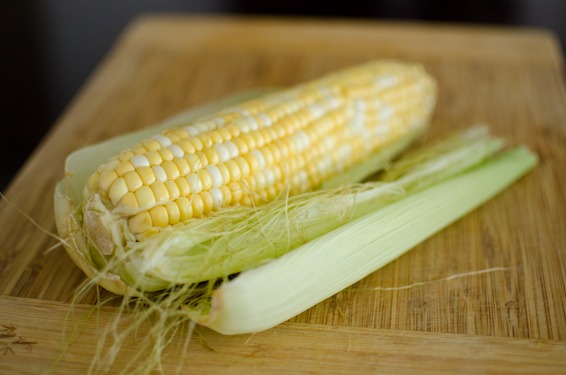 Sweet corn is removed from the husk
