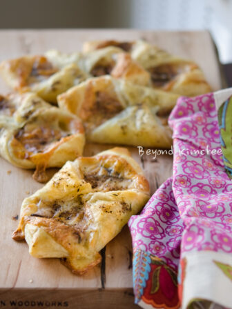 Ham and cheese pastry puffs are sprinkled with spice mixture.