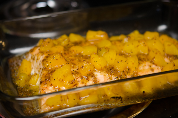 Salmon fillet with peach glaze baking in the oven.