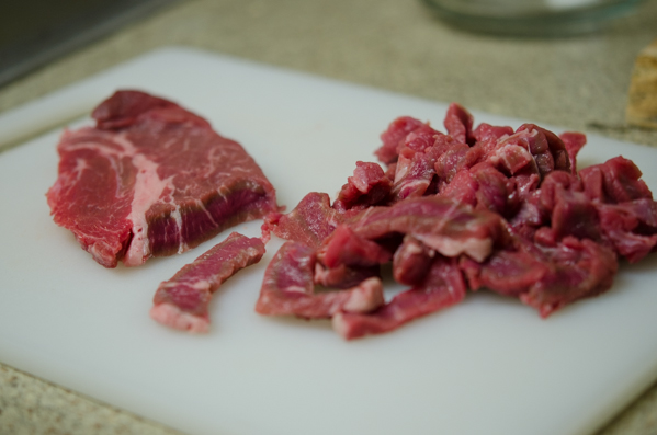 Beef steak is thinly sliced.