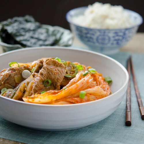 Old fermented kimchi braised with pork ribs are served with rice and roasted seaweed.