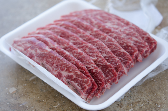 Strips of LA style short ribs are shown in their package.
