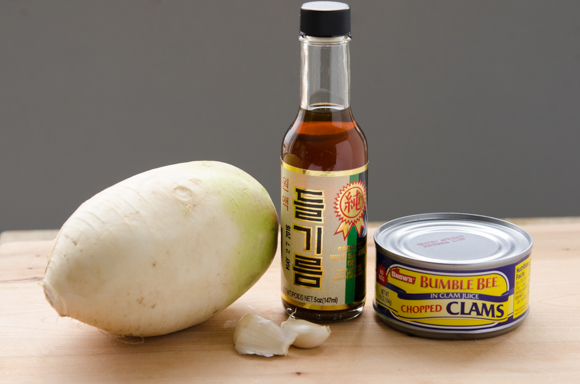 Korean radish, perilla oil and canned clam are presented to make Korean side dish.