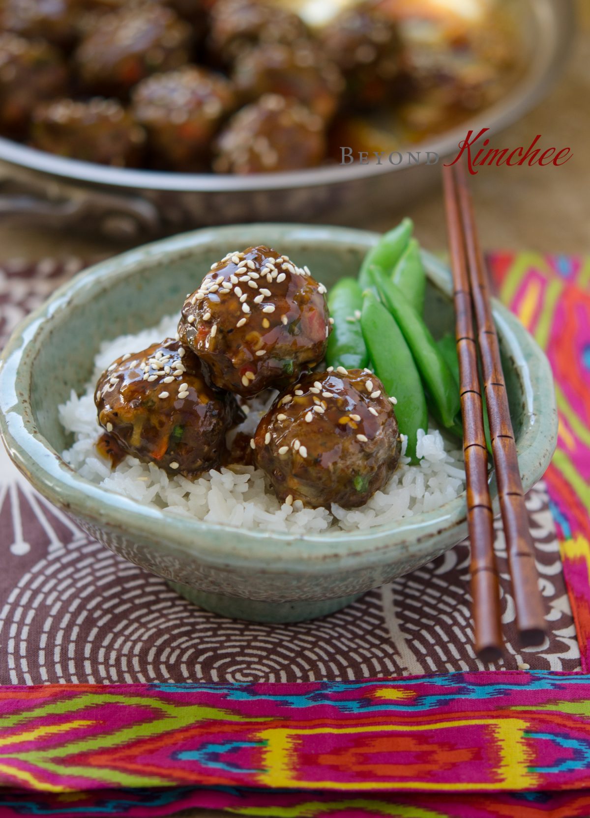 Beef Meatballs are glazed with Pineapple Soy Glaze and served with rice and snow peas.