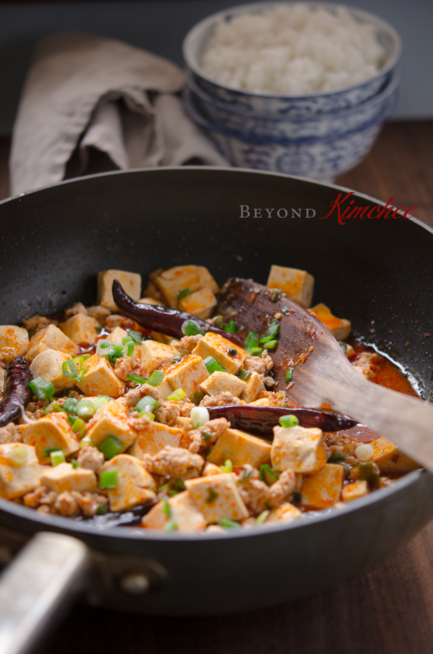 Mapo tofu with ground pork and fried chili is cooked in a small wok